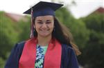 Graduate in cap and gown. Graduate in cap and gown.